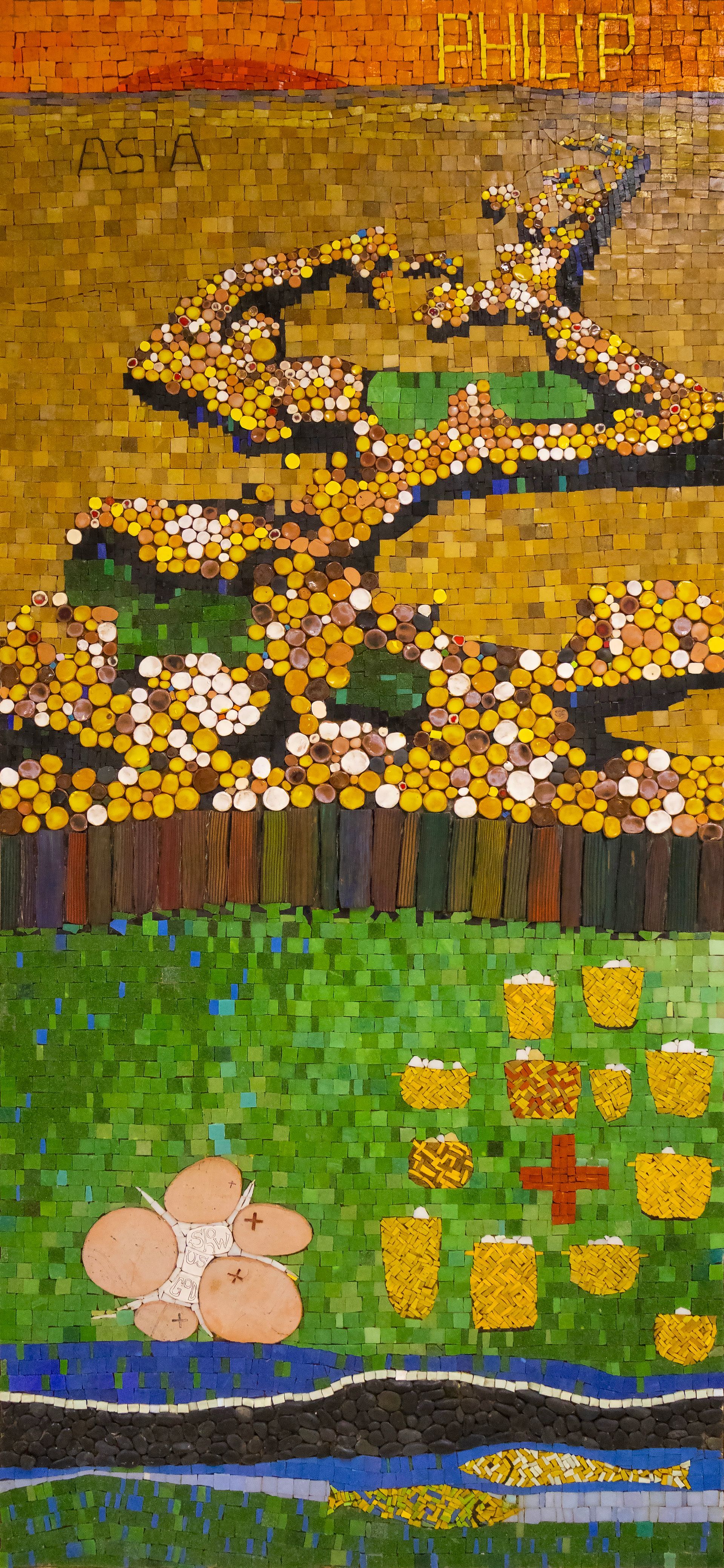 Mosaic art of a tree and flowers, with a red cross and gold shapes, in a garden setting.