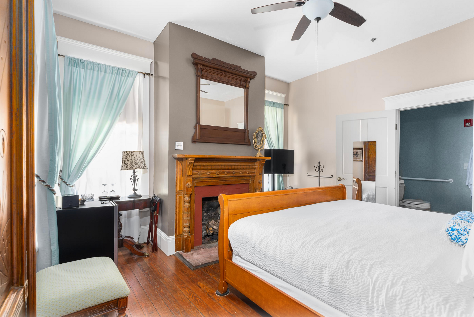 Bedroom with bed and fireplace