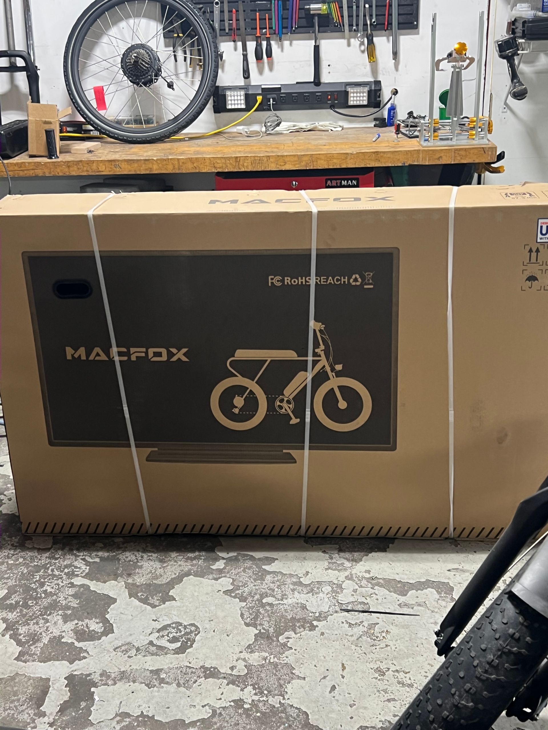 A cardboard box with a picture of a bicycle on it
