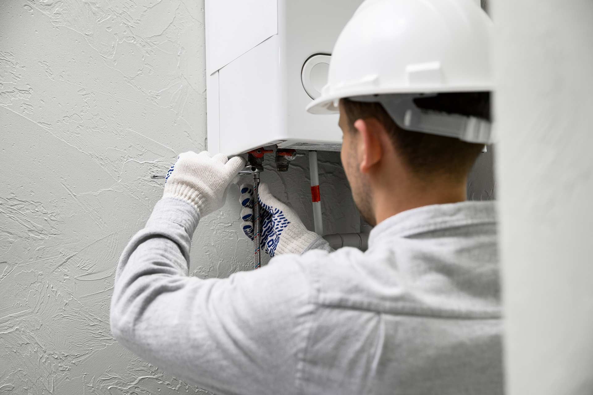 Man Carrying Out HVAC Service