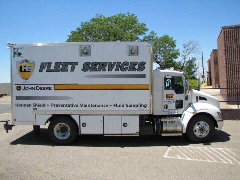 HE Fleet Services service struck partial wrap graphics Commerce City Colorado