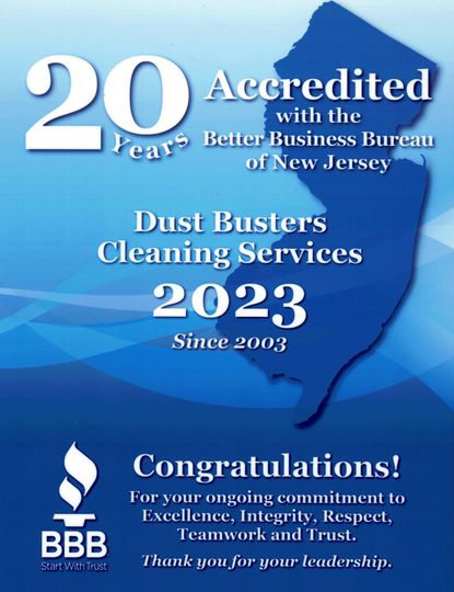 Blue BBB award badge for Dust Busters Cleaning Services, noting 20 years accredited and 2023 winner.