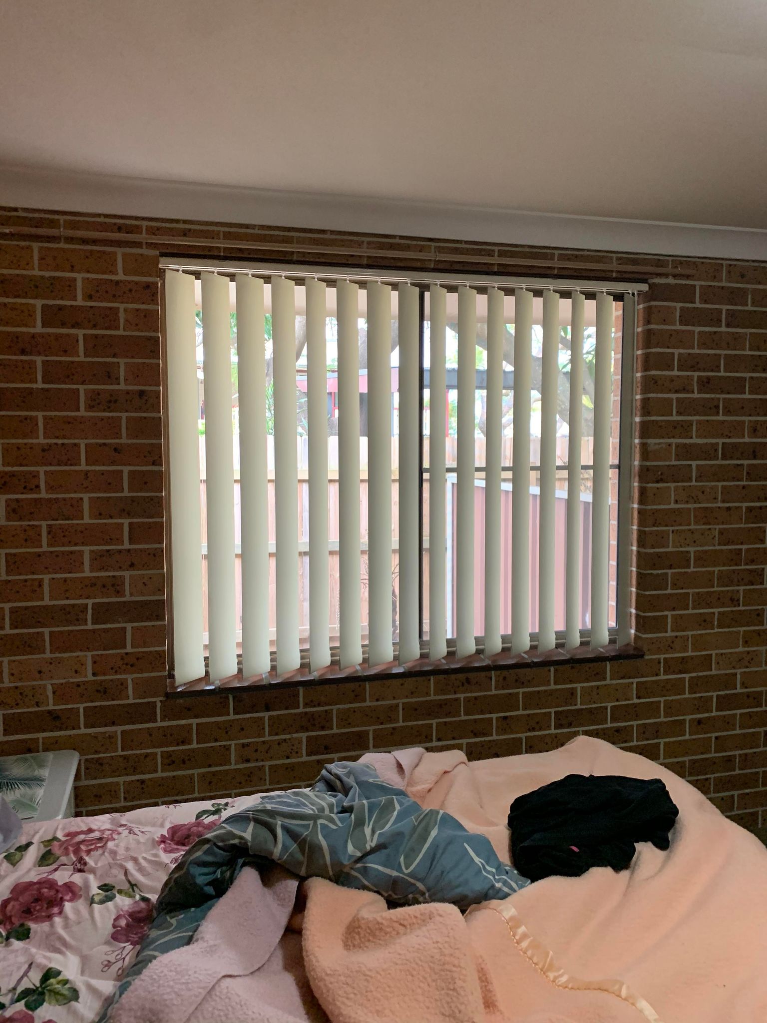 Bedroom Vertical Shutters — Blinds, Awnings & Shutters in Mid North Coast, NSW