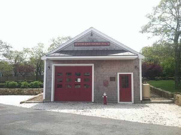 A small, grey-shingled building labeled 