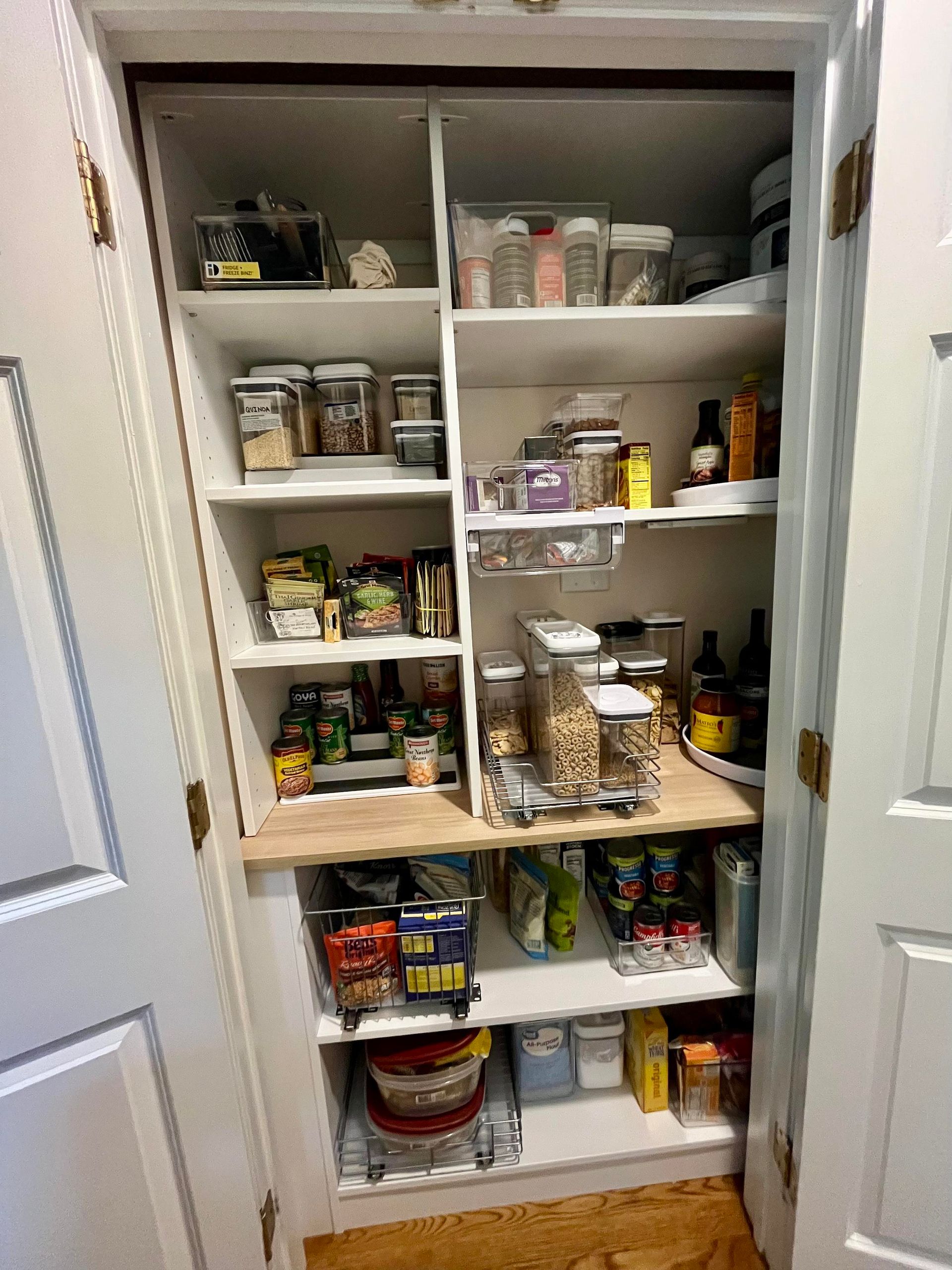A pantry filled with lots of food and spices.