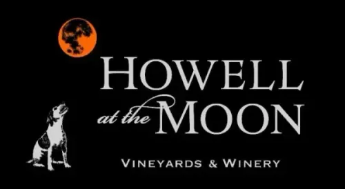 Howell at the Moon Vineyards & Winery logo with orange moon, dog silhouette, and white text on black background