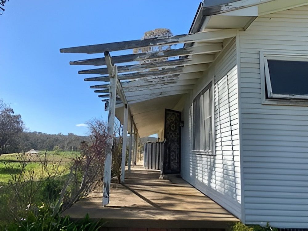 A White House With A Porch And A Blue Sky In The Background — L & S Wirth Painting in Dubbo, NSW