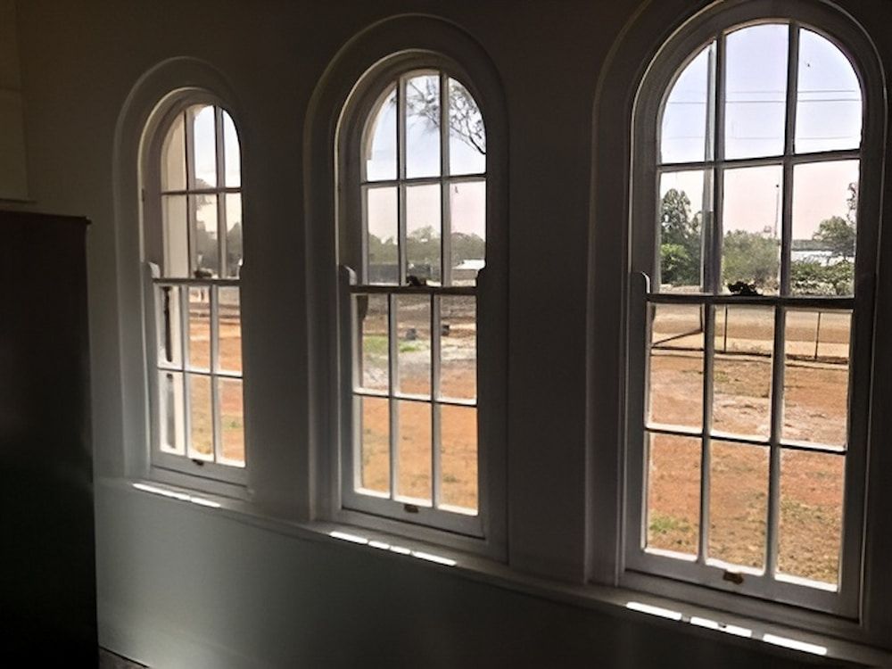 Three Arched Windows In A Room With A View Of A Field — L & S Wirth Painting in Dubbo, NSW