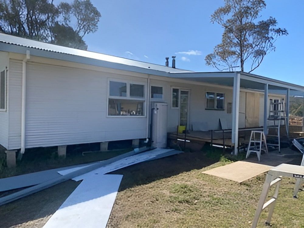 A White House With A Porch And A Ladder In Front Of It — L & S Wirth Painting in Dubbo, NSW