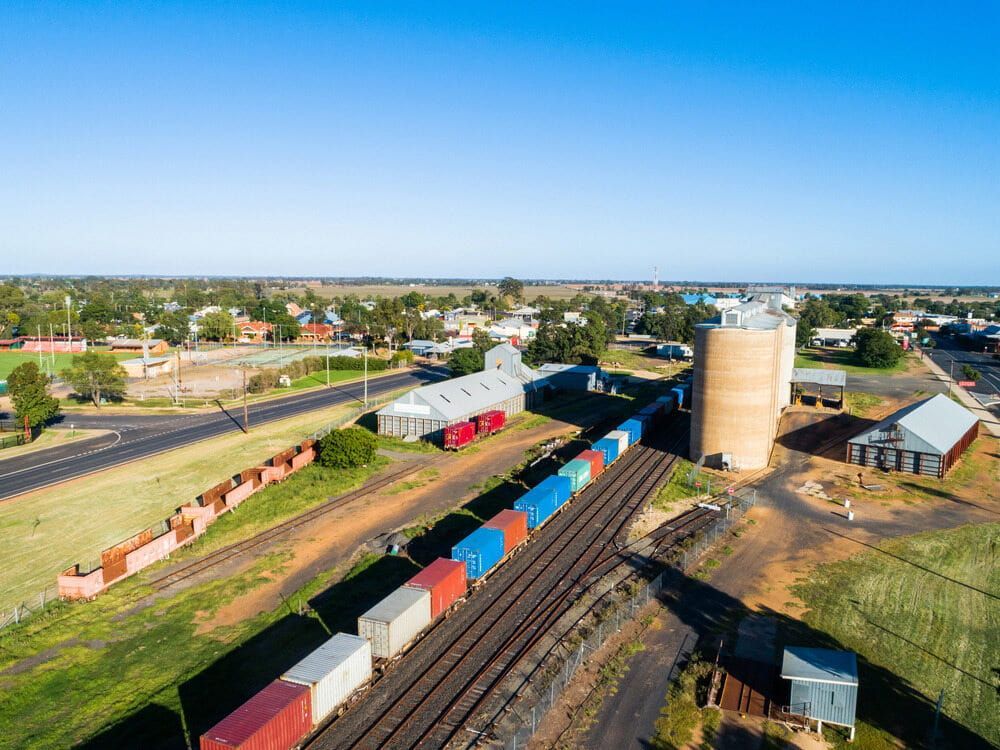 An Aerial View Of A Train Going Down Train Tracks — L & S Wirth Painting in Narromine, NSW