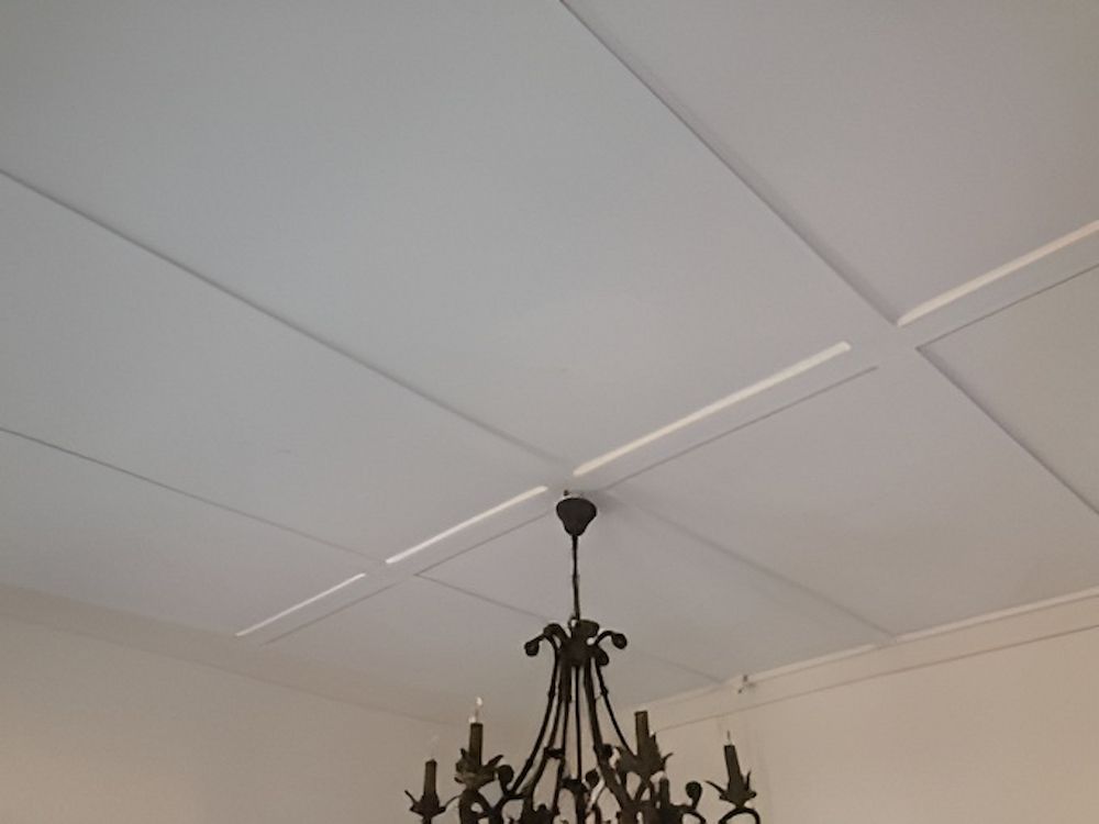 A White Ceiling With A Black Chandelier Hanging From It — L & S Wirth Painting in Dubbo, NSW
