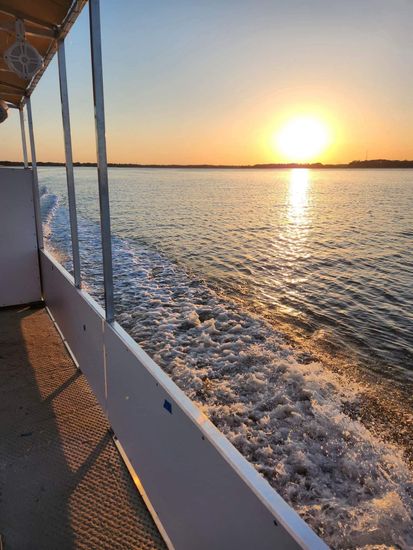 The sun is setting over a body of water
