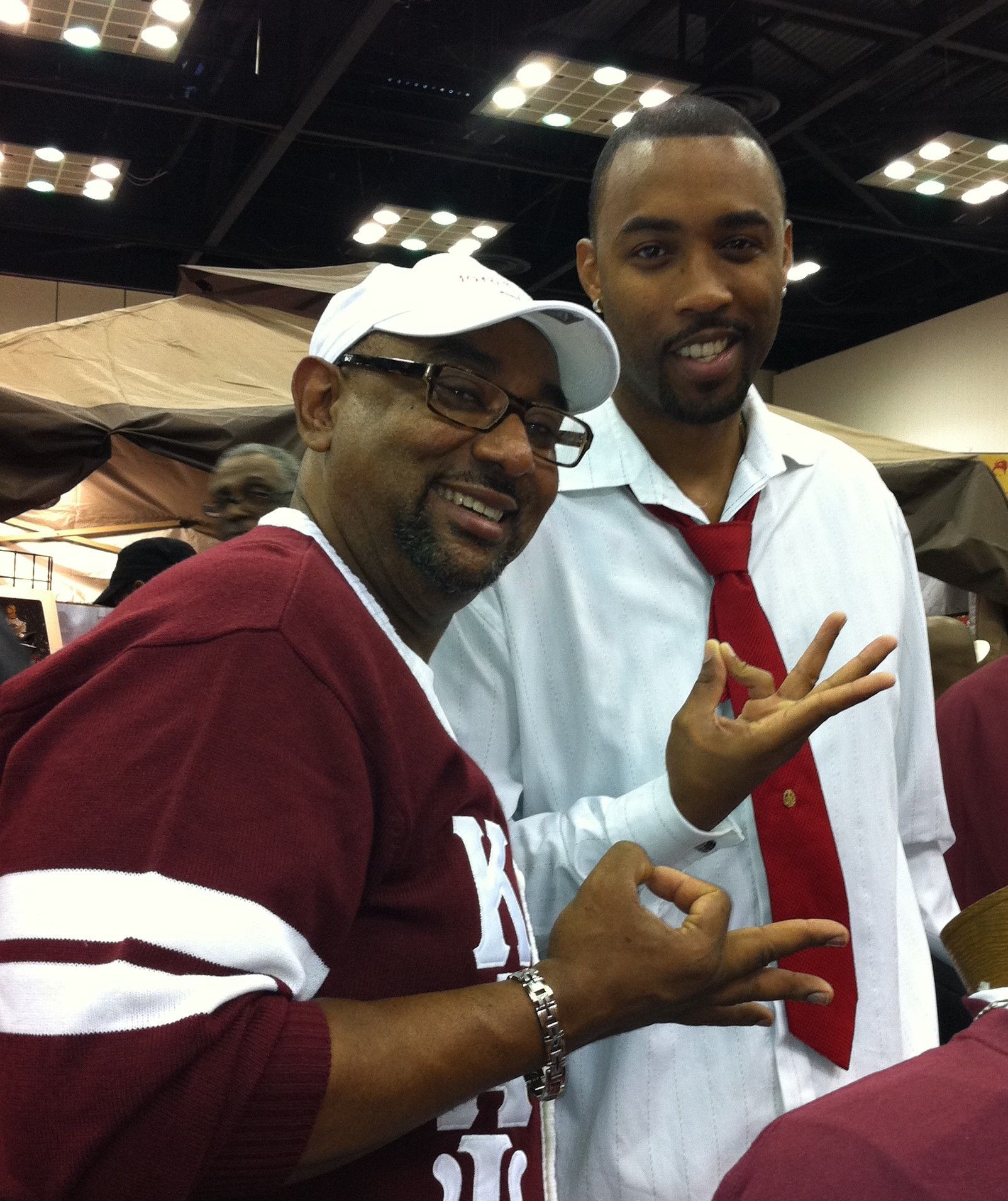 A man wearing a maroon shirt with the letter y on it