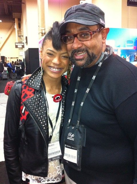 A man and a woman are posing for a picture together