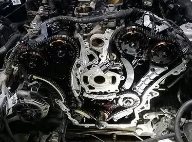 a close up of a car engine with the timing chains removed .