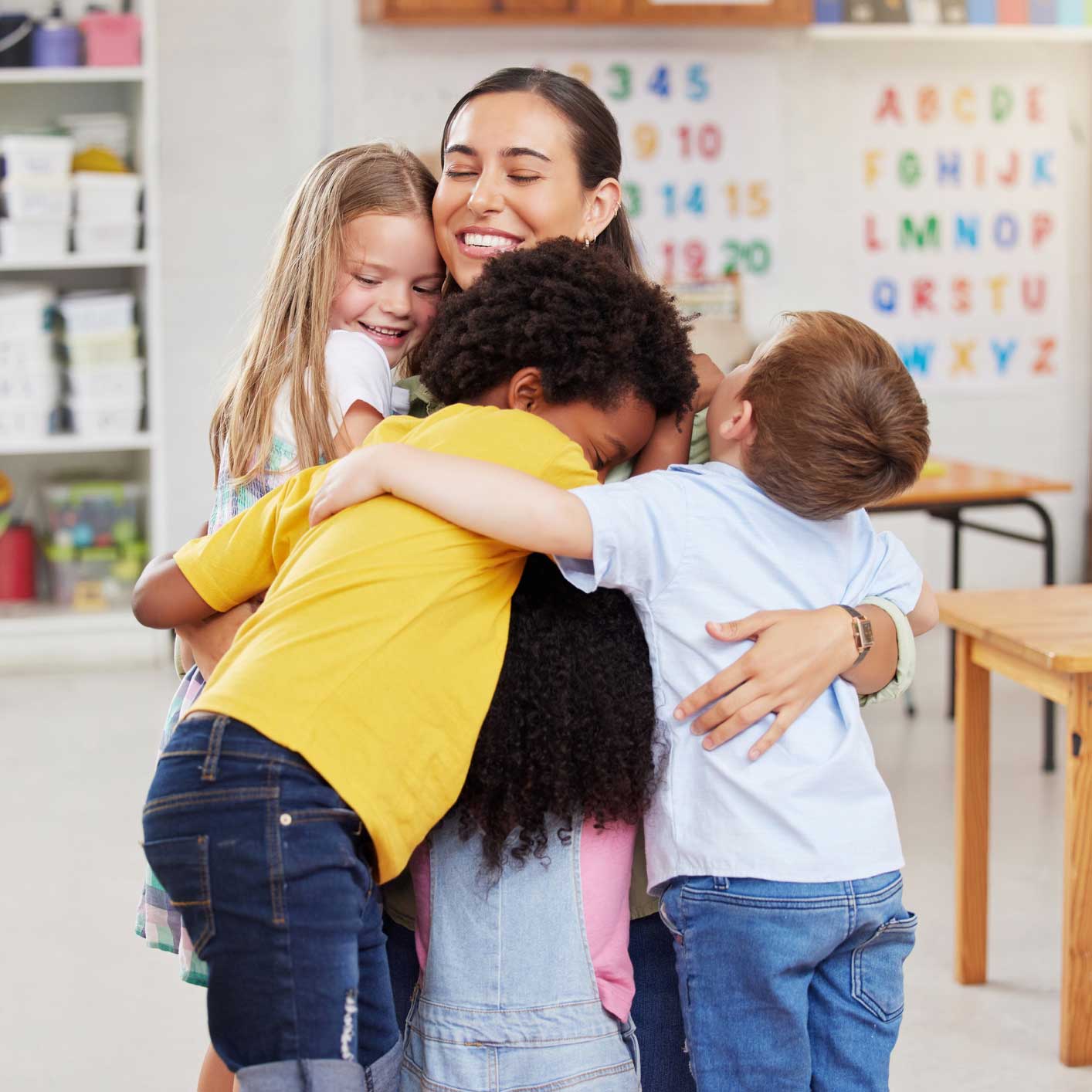 Kids hugging their teacher — Richfield, NC — Richfield Child Development Center Kids hugging their teacher — Richfield, NC — Richfield Child Development Center