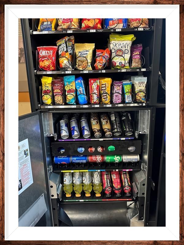 A vending machine filled with lots of snacks and drinks.