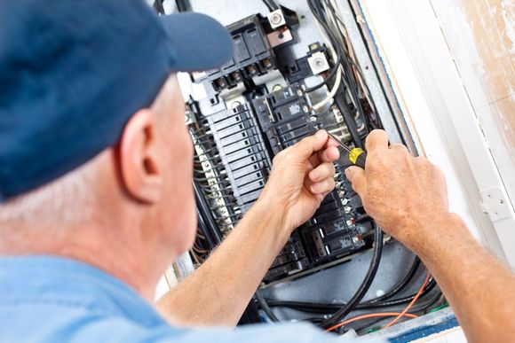 Electrician Working — Warsaw, MO — H & C Plumbing & Electrical