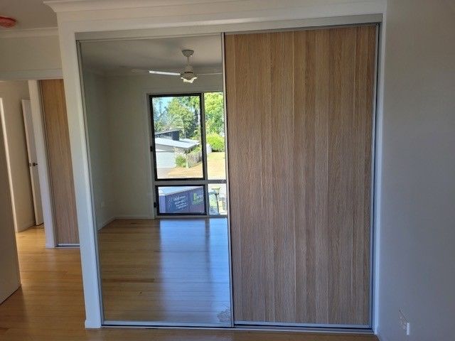A Picture of a Closet With Sliding Door — Cairns Custom Wardrobes in Manunda, QLD
