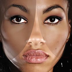 A close up of a woman 's face with different shades of skin.
