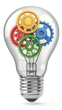A light bulb with colorful gears inside of it.