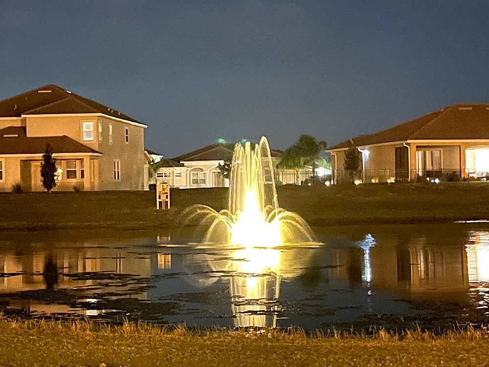lighted floating fountain at night installed in Davenport