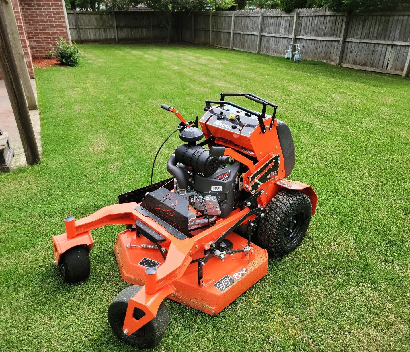 a riding lawn mower on a freshly mowed lawn