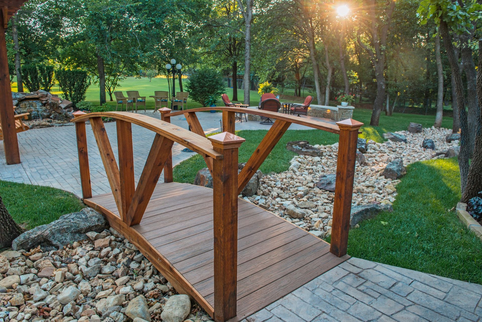 a bridge over a riverbed landscaping feature