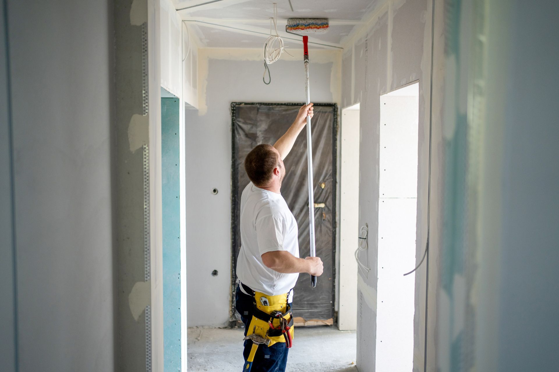 man makes repairs at home