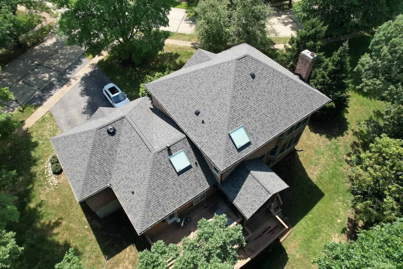 Asphalt shingle and skylight installation in St. Louis, MO