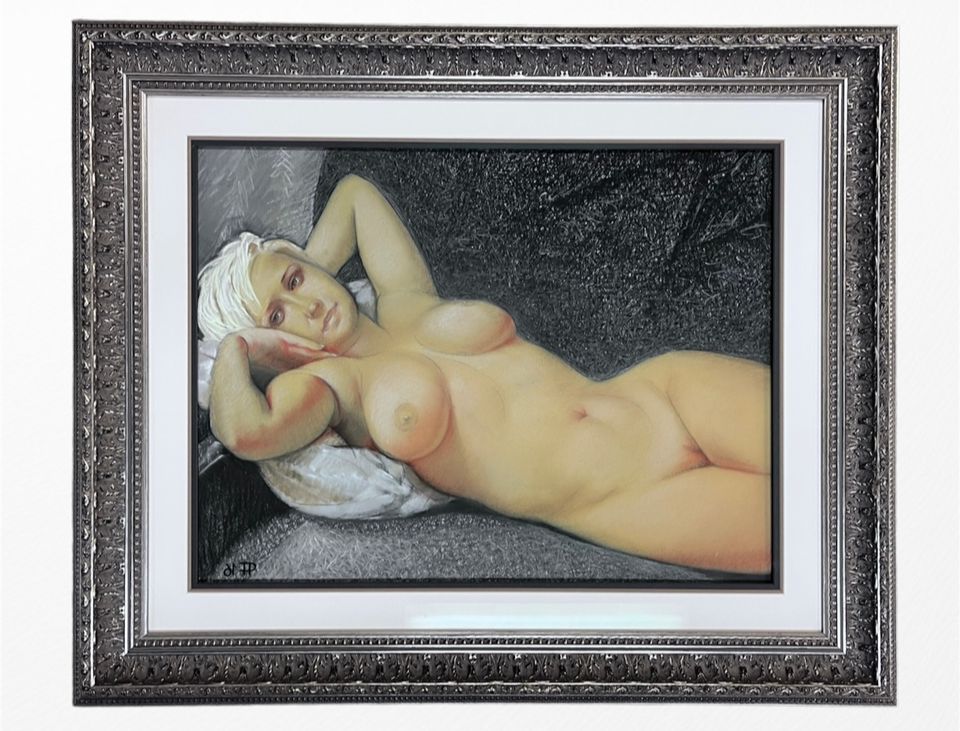 A framed oil painting of a reclining figure with a white head covering, resting on a pillow against a dark background.