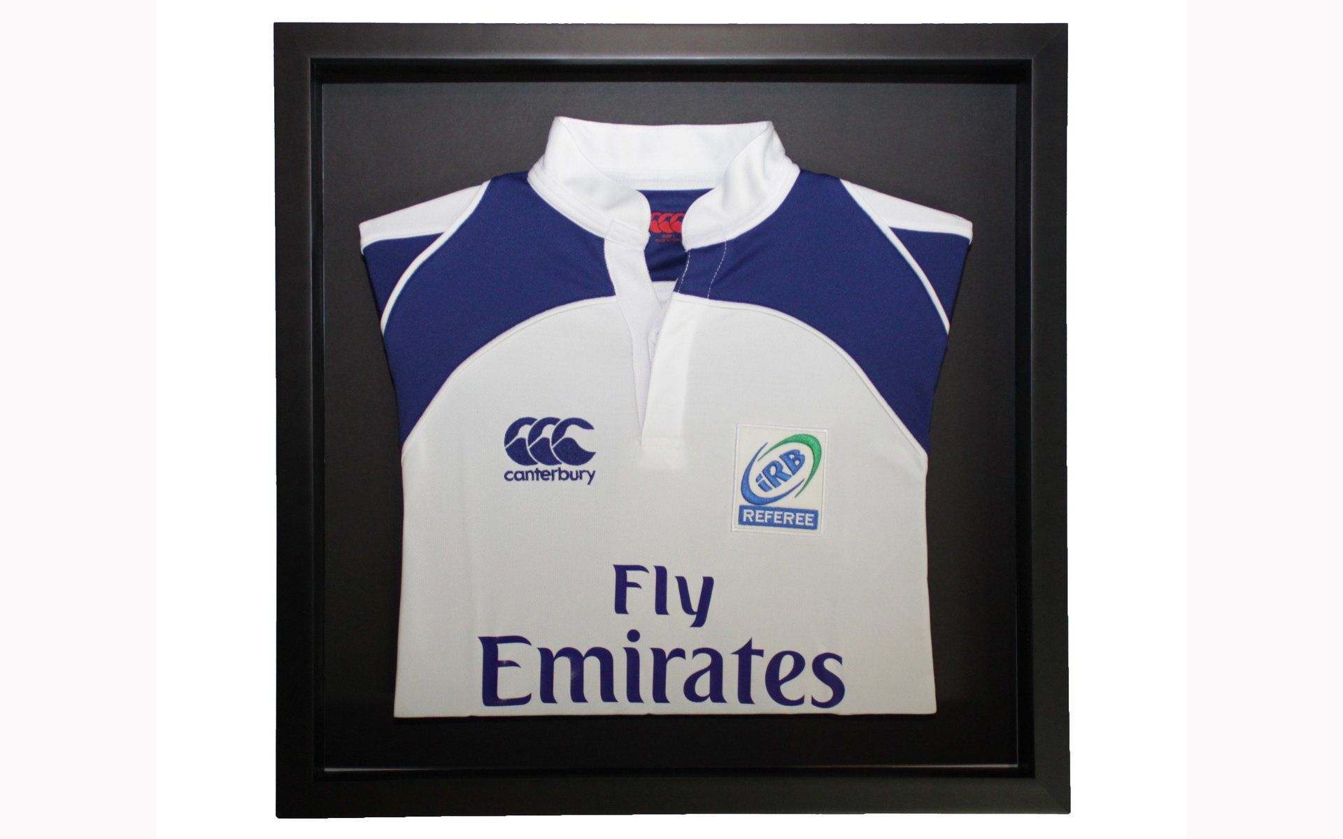 A white and blue rugby jersey with a Fly Emirates logo, displayed in a black shadow box frame against a white background.