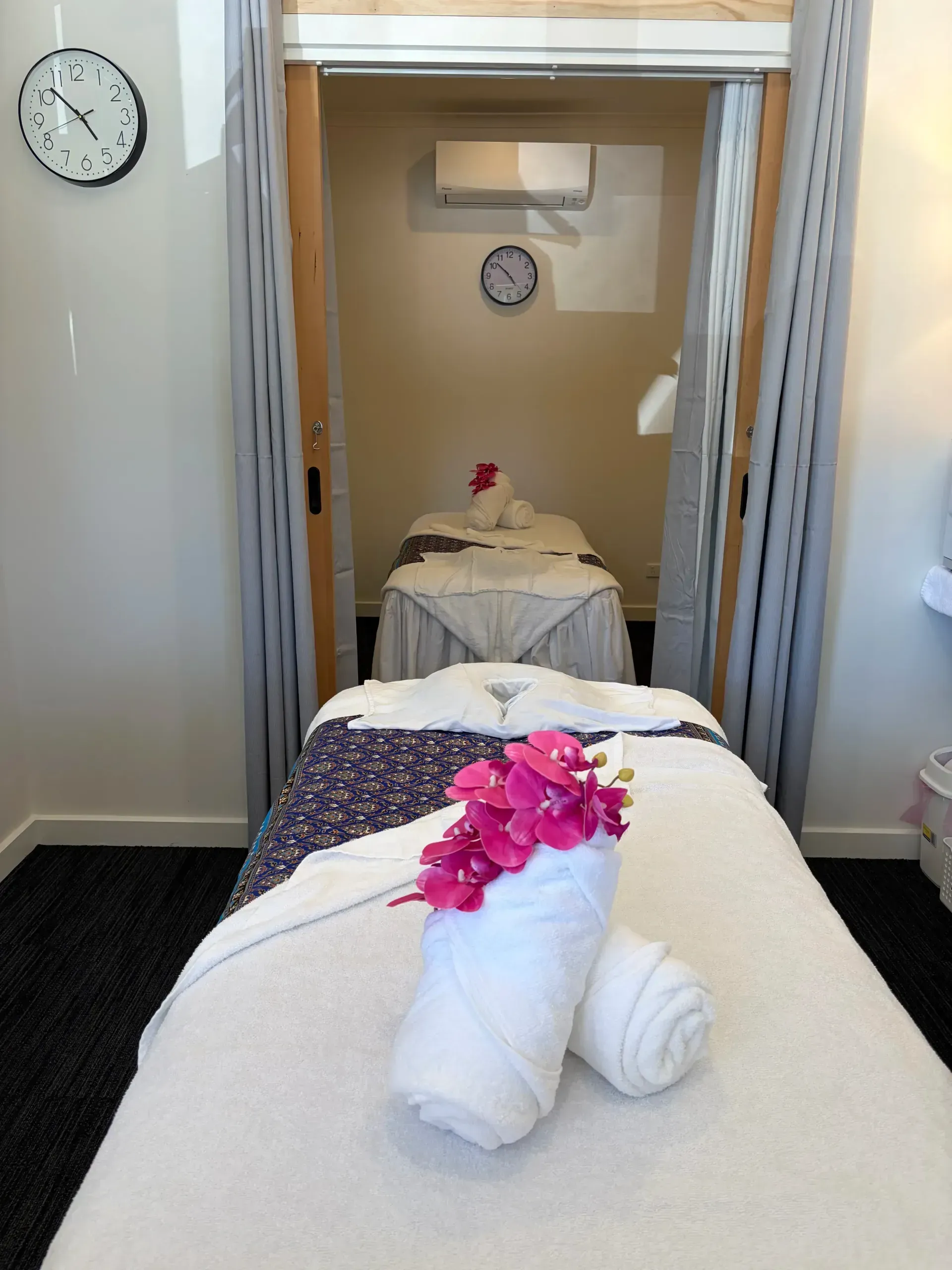 Clean and relaxing couples massage treatment room at Tuk's Thai Massage
