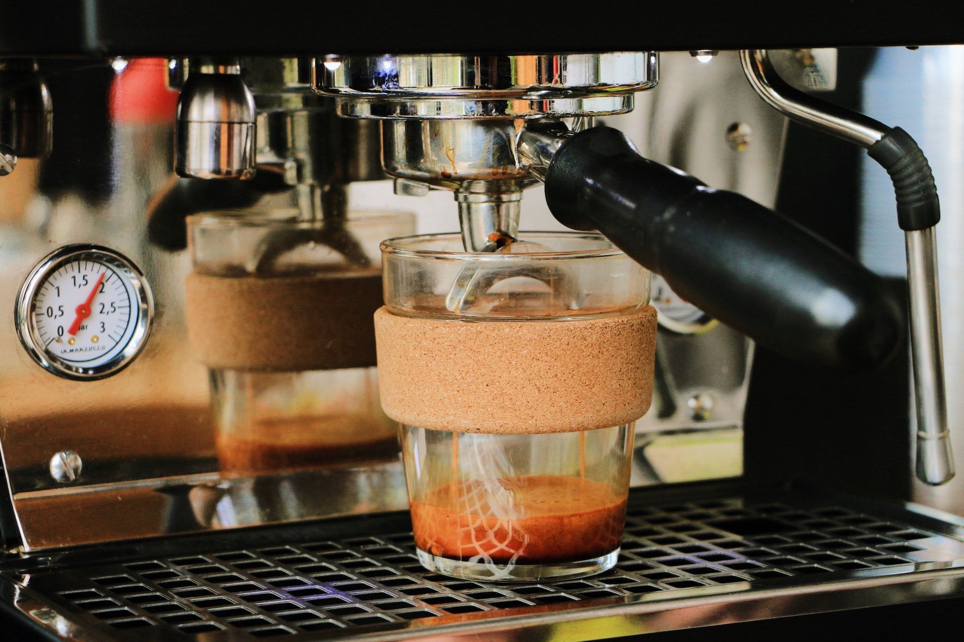 Clear Coffee Glass on Silver Espresso Machine