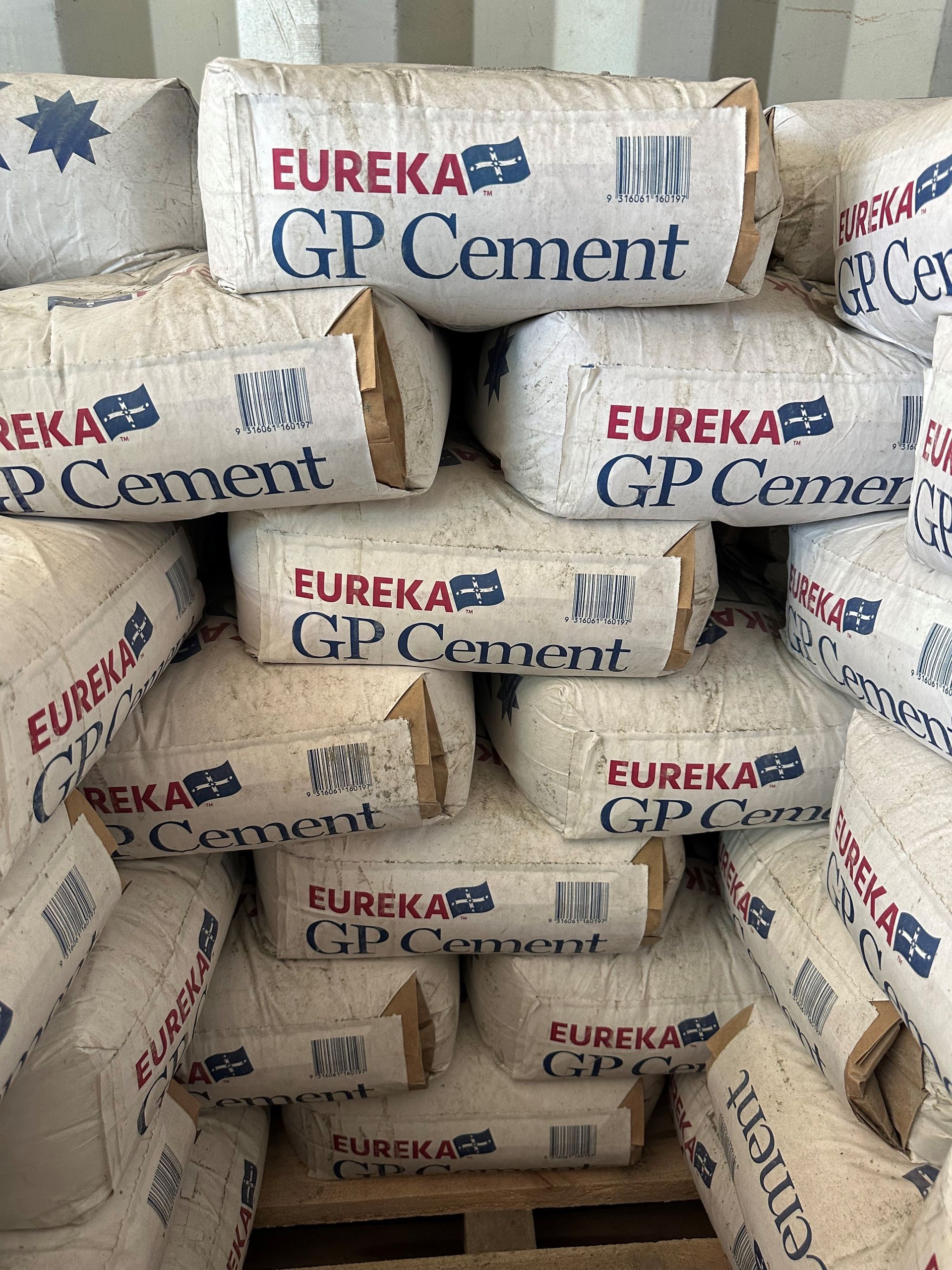 A Pile of Bags of Eureka GP Cement Are Stacked on Top of Each Other — Dampier Street Landscape Supplies in Taminda, NSW