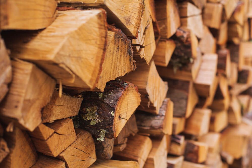 A pile of logs stacked on top of each other — Dampier Street Landscape Supplies in Taminda, NSW