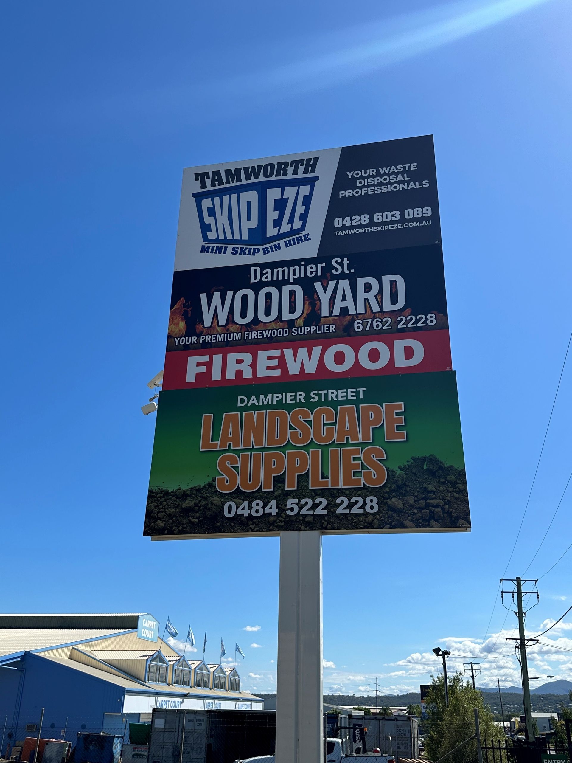 A Large Billboard Advertising Wood Yard Firewood and Landscape Supplies — Dampier Street Landscape Supplies in Taminda, NSW
