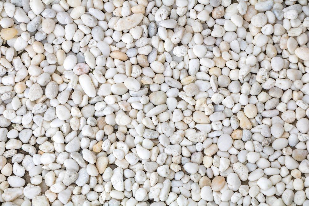 A Pile of White Rocks is Sitting on the Ground — Dampier Street Landscape Supplies in Taminda, NSW