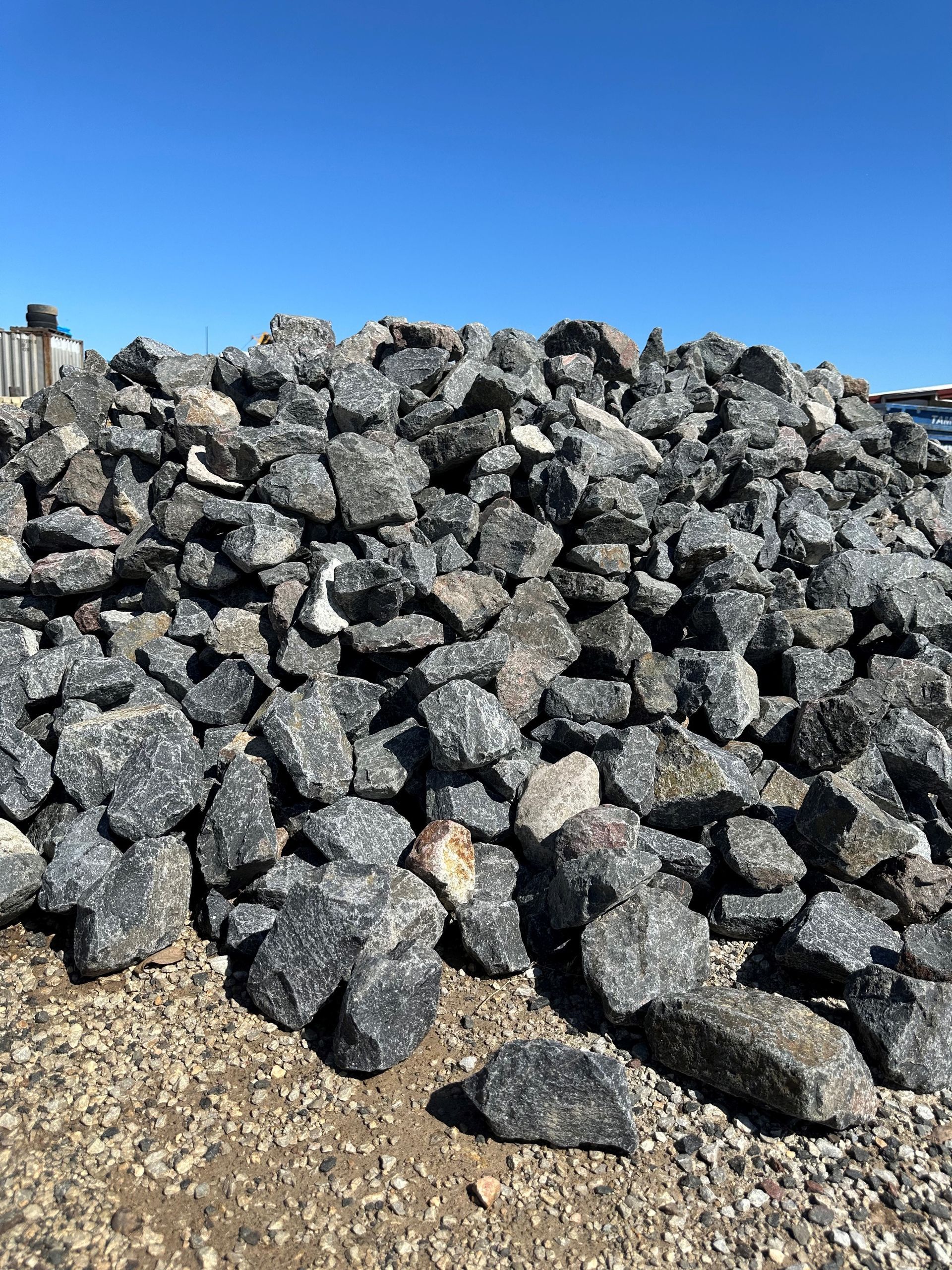 A Pile of Rocks Sitting on Top of a Dirt Field — Dampier Street Landscape Supplies in Taminda, NSW