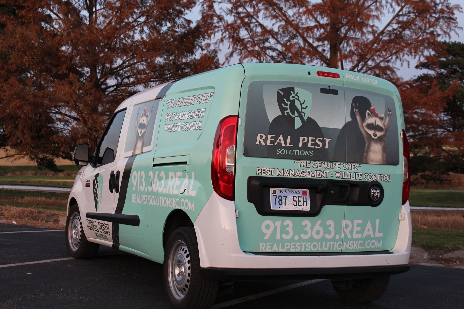 A light blue work van featuring 