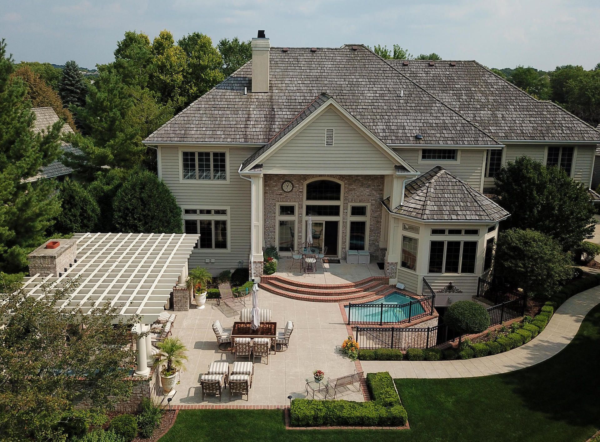 Home with a backyard pool and patio