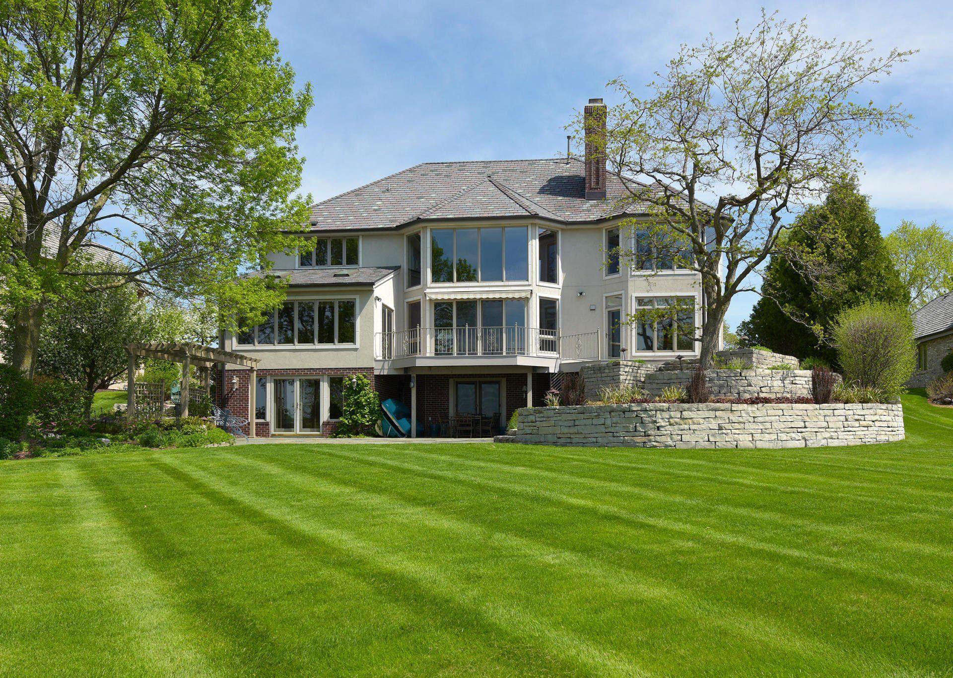 Lake Country home with a lawn running down to the water