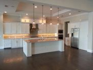There is a large island in the middle of the kitchen.