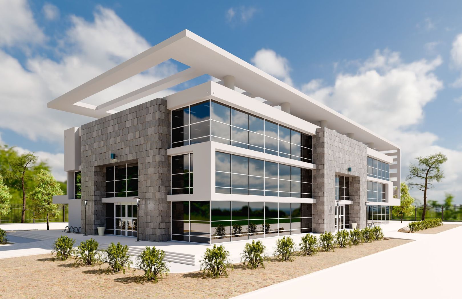 Modern glass-and-stone office building with a slanted white roof and landscaped surroundings
