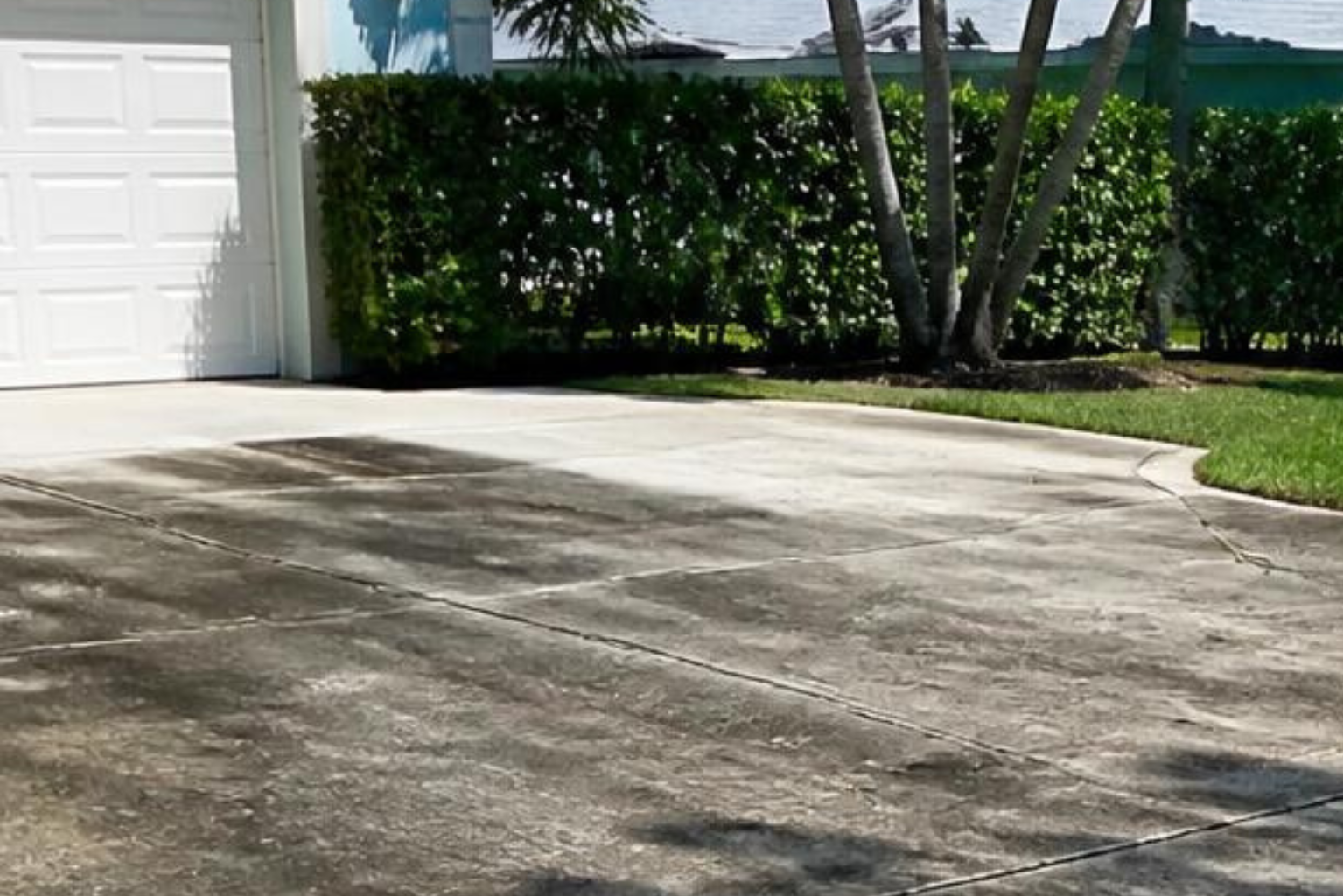 Driveway before pressure washing