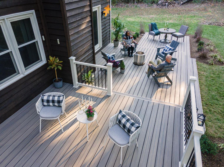 Spacious composite deck with dining and lounge furniture after Deck Building Services in Buckeye, AZ for outdoor comfort