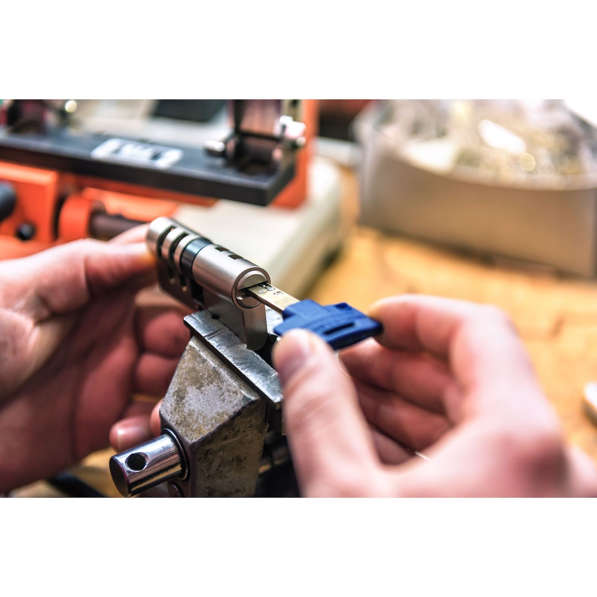 Locksmith repairing a lock and key