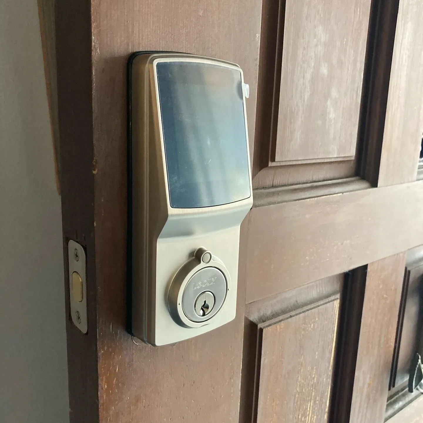 close view of smart lock installed on front door.