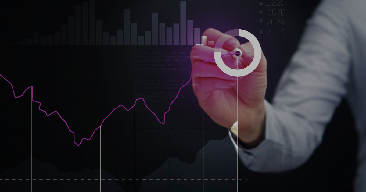 Hand on a clear whiteboard showing analytics