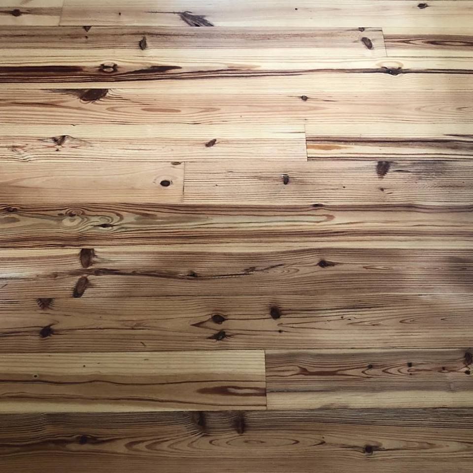 Light wood plank floor with natural knots and grain patterns